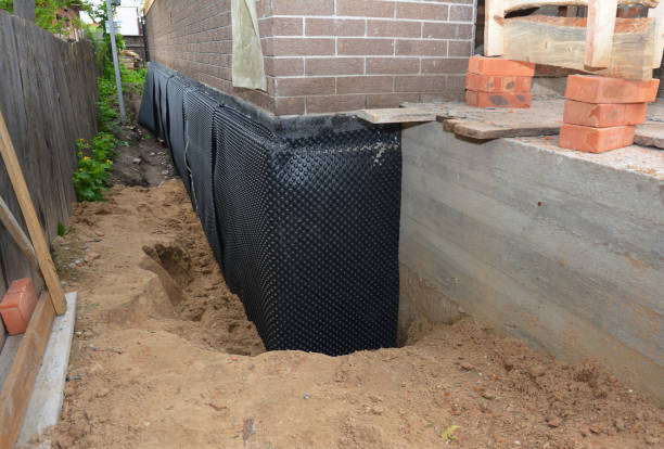 Happy homeowners after waterproofing job in Davidson